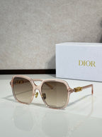 Dior sunglasses with rose-gold frame and light lenses, gold accents
