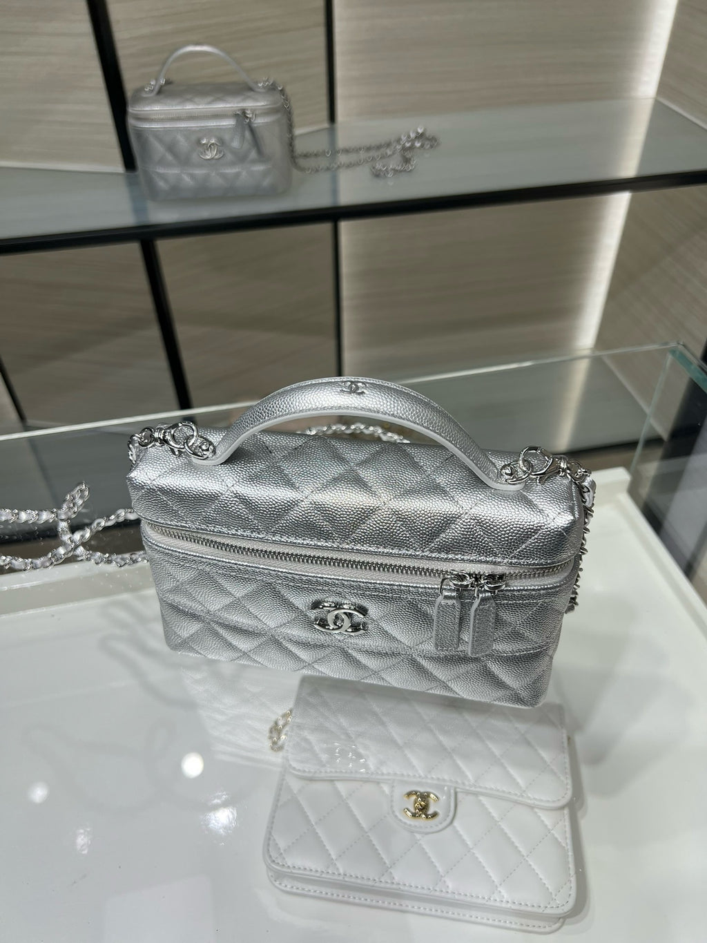 Chanel quilted mini shoulder bag in silver-tone with top handle, chain strap and logo