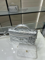 Chanel quilted mini shoulder bag in silver-tone with top handle, chain strap and logo