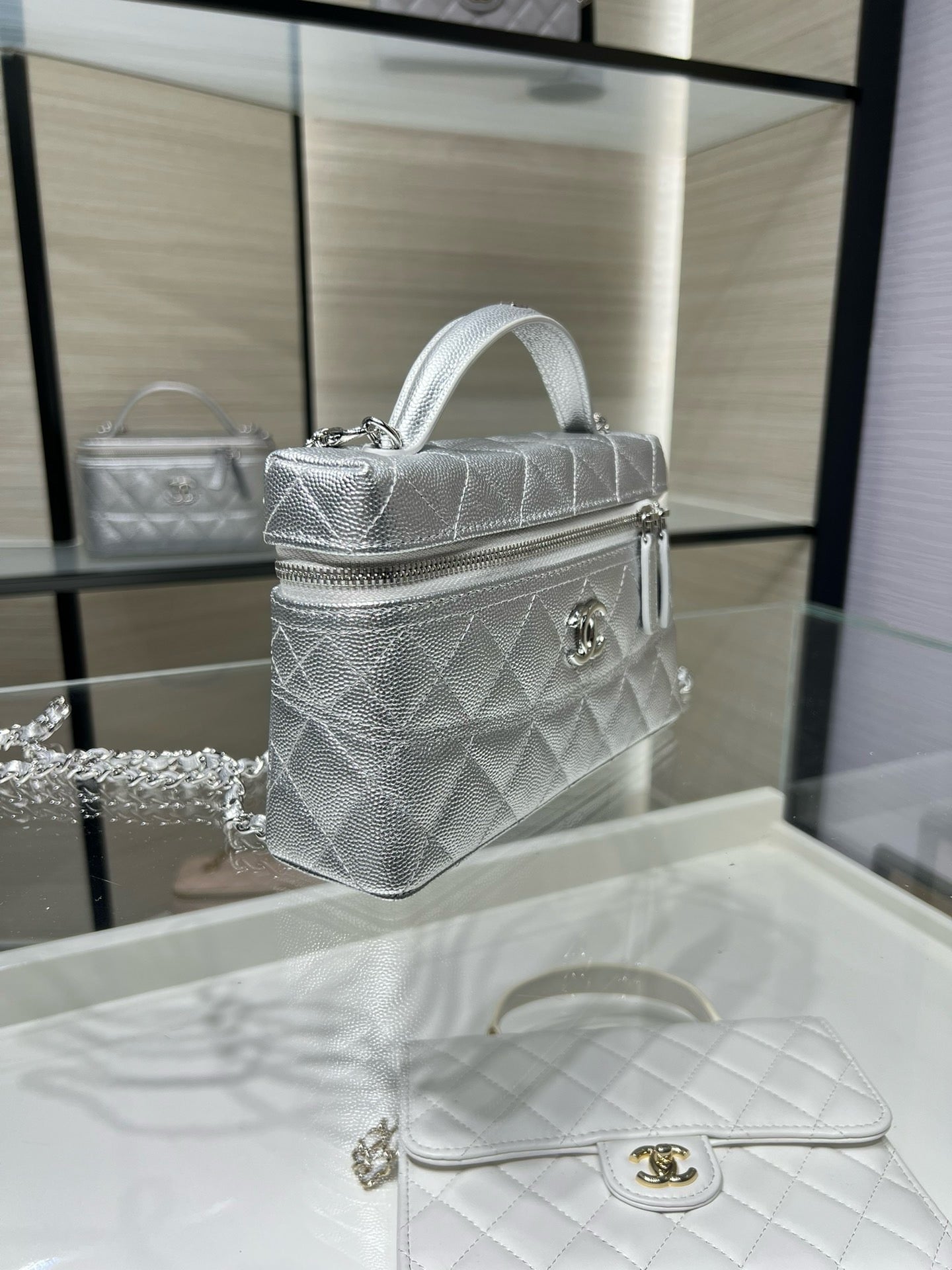 Chanel quilted mini shoulder bag in silver-tone with chain strap and logo clasp