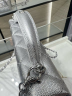 Chanel silver-tone quilted mini bag with chain strap and metal ring hardware detail