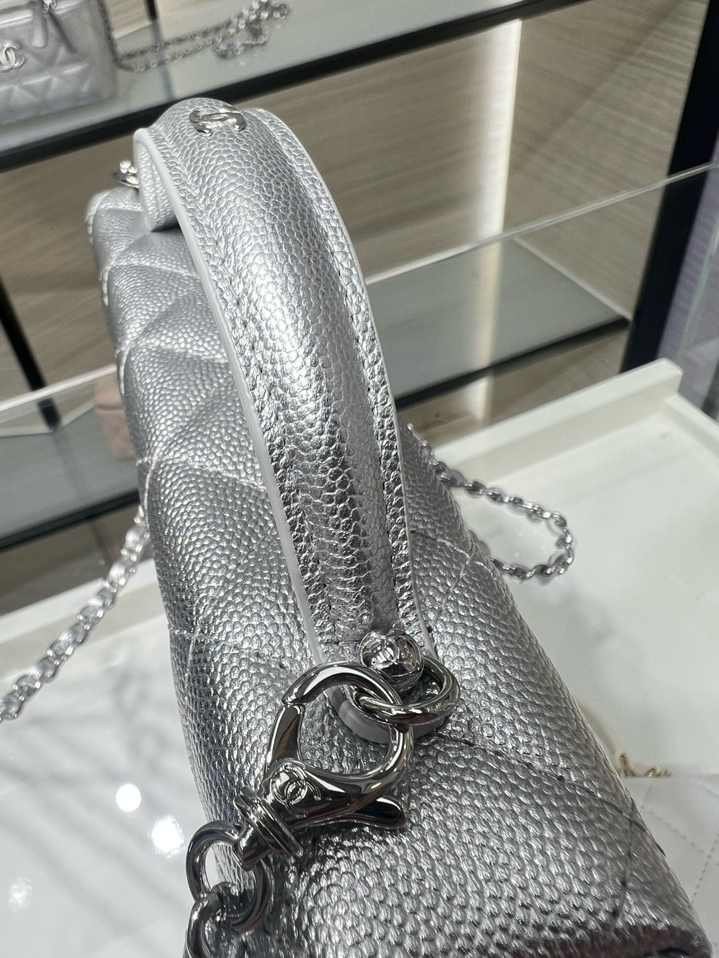 Chanel silver-tone quilted mini bag with chain strap and metal ring hardware detail