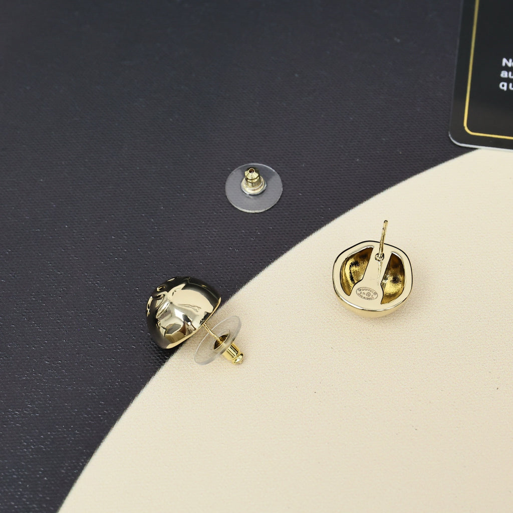 Gold-tone button stud earrings with Chanel-style logo on dark blue case insert