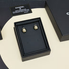 Gold-tone button stud earrings with Chanel-style logo in black gift box