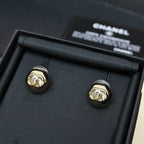Gold-tone and black button stud earrings with Chanel-style logo in box