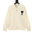 Amiri knit sweater, cream polo collar with black heart and 'X' graphic