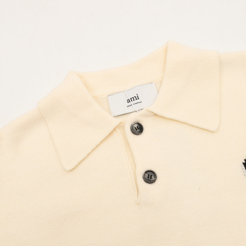 Amiri knit sweater close-up: cream polo collar and two-button placket