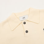 Amiri knit sweater close-up: cream polo collar and two-button placket