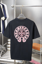 Dark navy short-sleeve T-shirt with large circular pink-and-white front graphic.