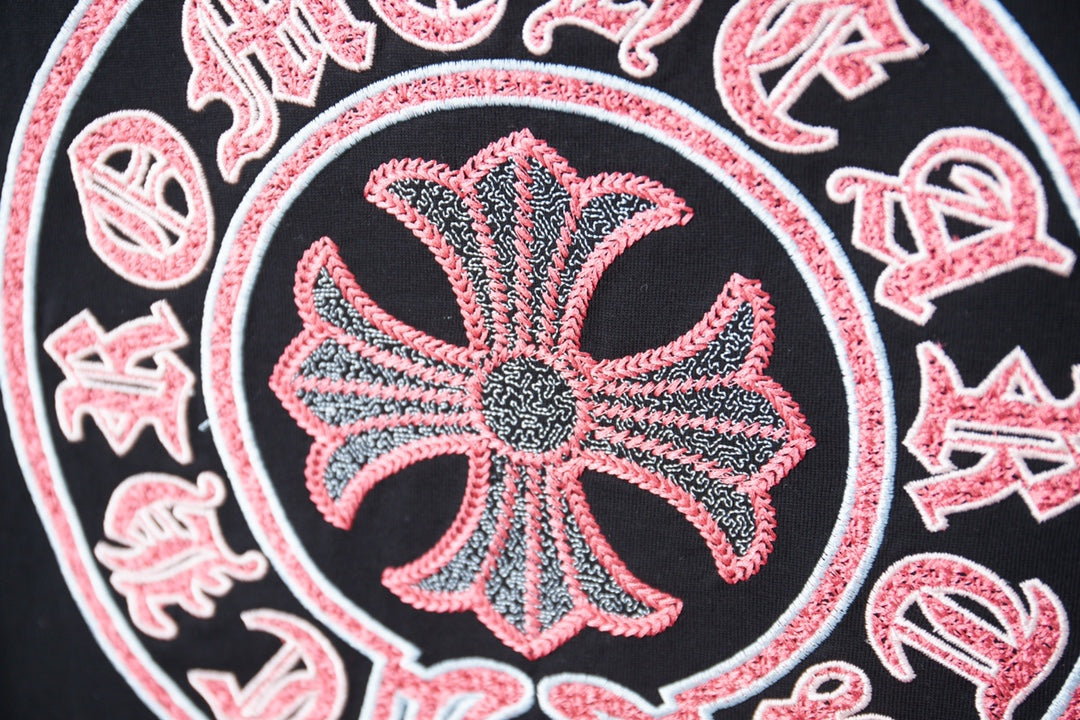 Close-up of red and pink flower graphic inside a circular design