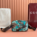 Gucci mini crossbody bag with teal camouflage GG canvas and leather trim