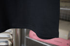 Dark T-shirt hem and sleeve cuff seam
