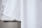 White short-sleeve T-shirt sleeve and hem, embroidered detail near chest