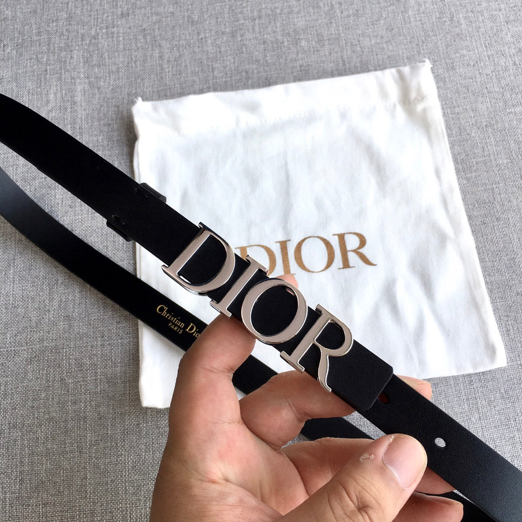 Dior belt close-up of silver buckle on black strap with Dior logo