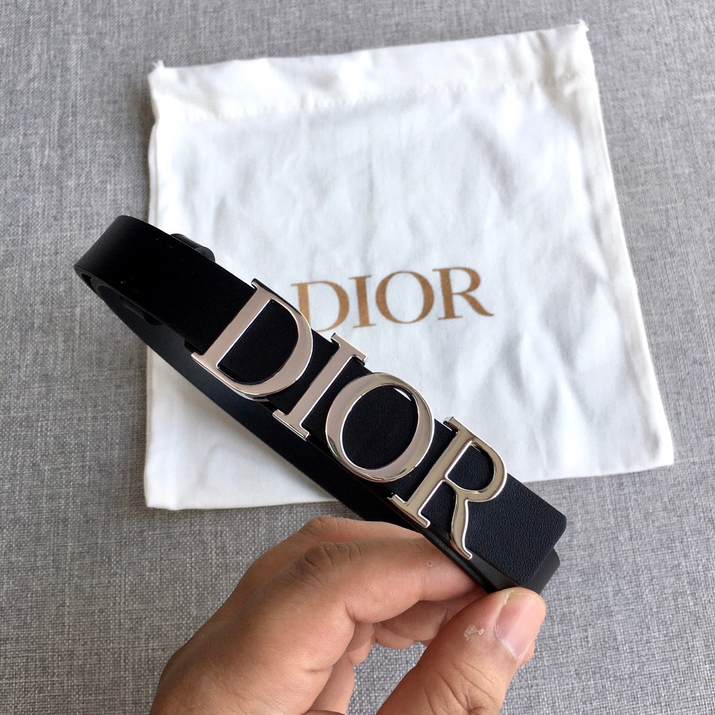 Dior belt with black strap and silver buckle, Dior lettering detail