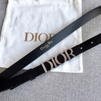 Dior belt black strap with silver buckle and Dior lettering, flat lay
