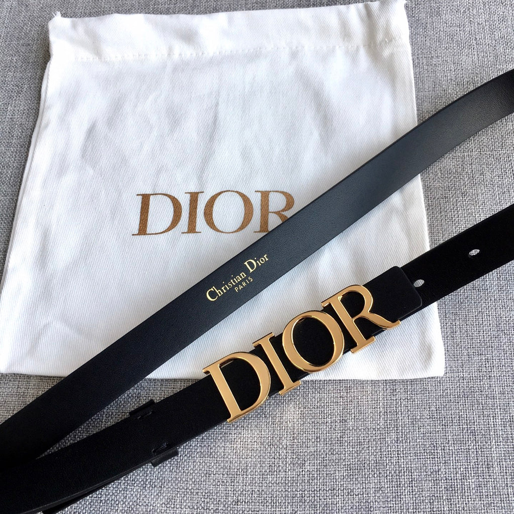 Black belt with large gold-tone Dior logo buckle and leather strap, angled view