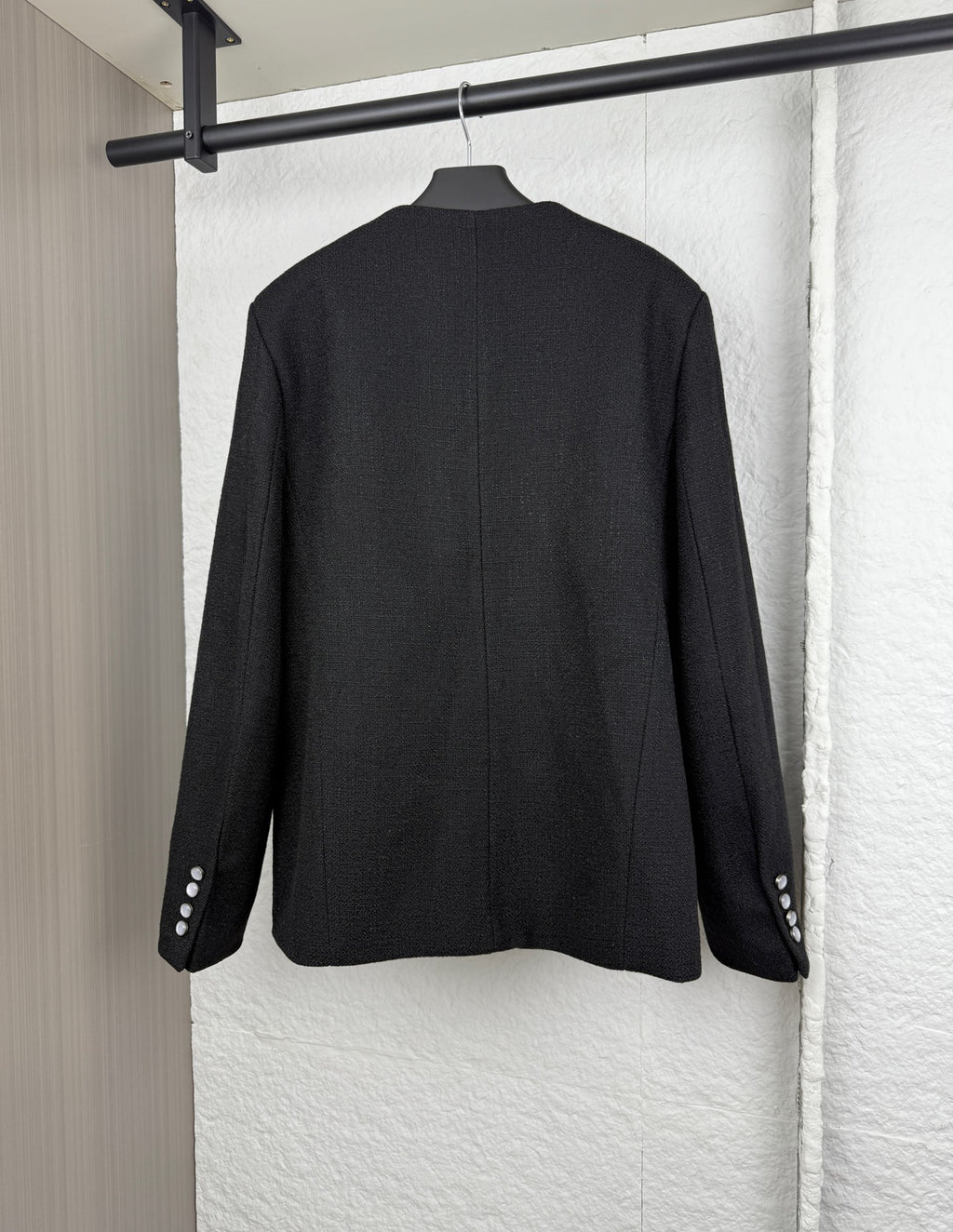 Black Louis Vuitton long jacket back view with buttoned cuffs