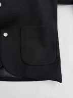 Black Louis Vuitton jacket front pocket with buttoned placket