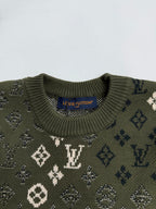 Green knit sweater collar with monogram pattern and ribbed crew neck