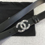 Chanel belt with rhinestone CC buckle and black strap with a wrapped keeper section.