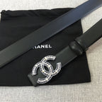 Chanel belt with rhinestone CC logo buckle and black strap with double-prong keeper.
