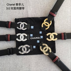 Set of Chanel belts: black straps with different CC buckle colors and red end accents.