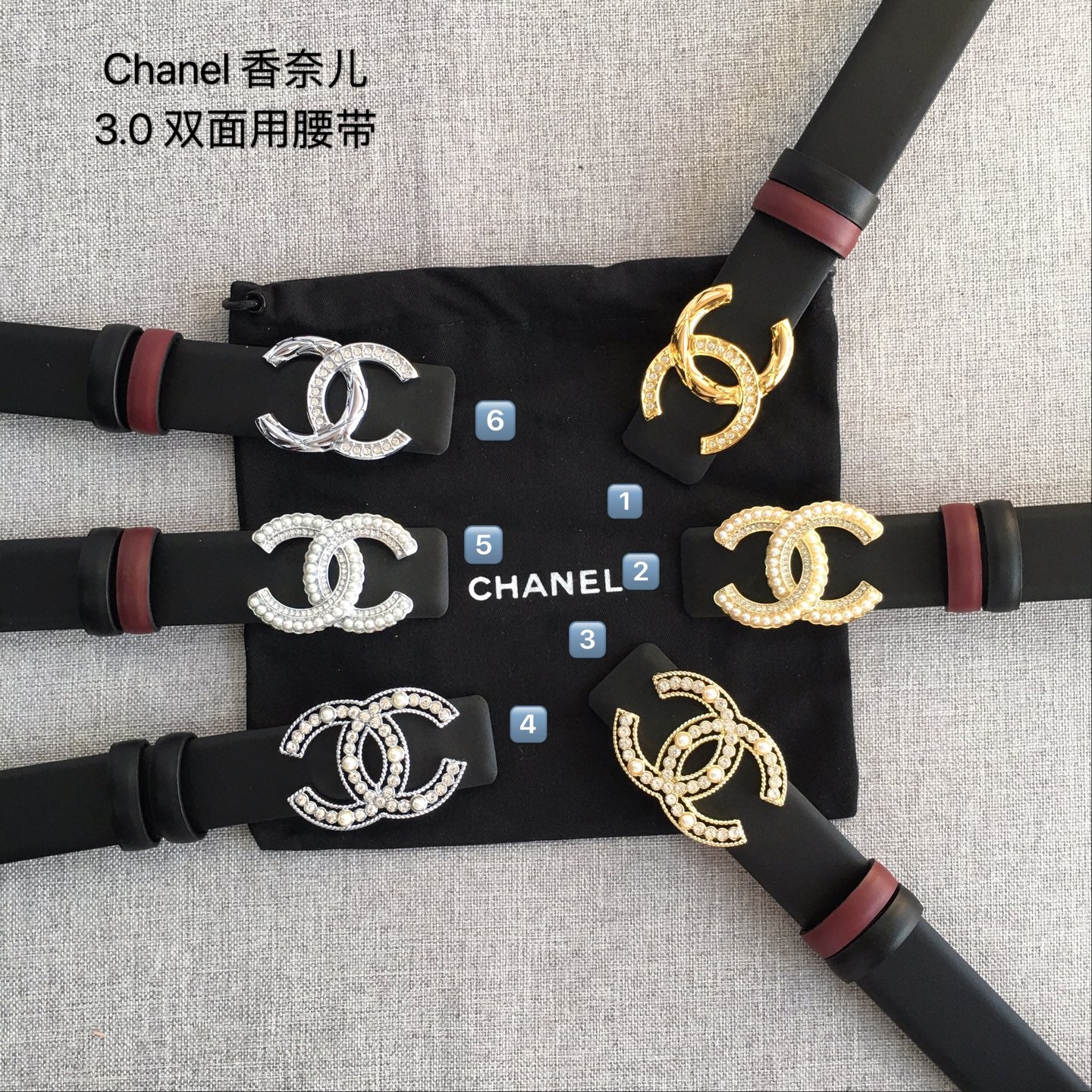 Set of Chanel belts: black straps with different CC buckle colors and red end accents.