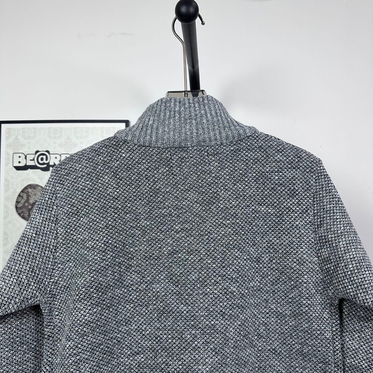 Grey textured knit jacket back with mock neck and ribbed collar