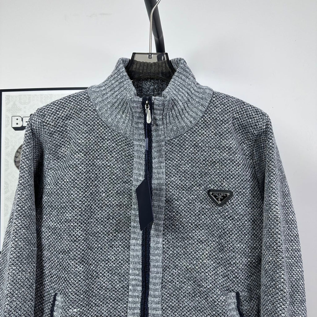 Grey textured knit jacket, full-zip with mock neck and triangle logo on chest