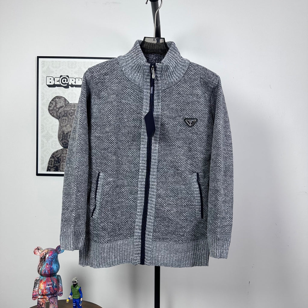 Grey textured knit full-zip jacket with mock neck and small triangle chest logo