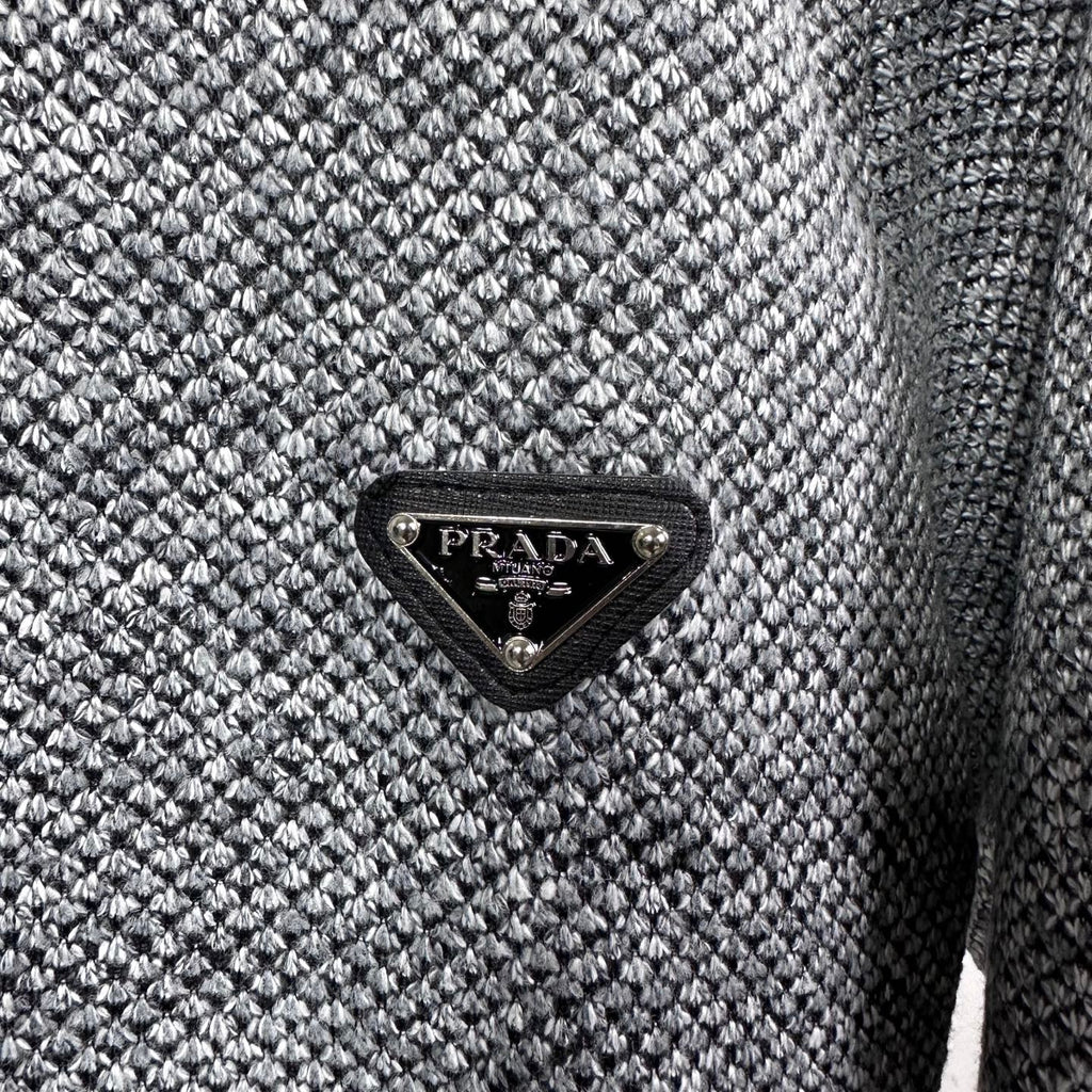 Grey textured knit jacket with black triangular PRADA logo patch