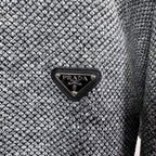 Grey textured knit jacket with black triangular PRADA logo patch