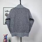 Grey textured knit jacket back view with ribbed mock neck and cuffs