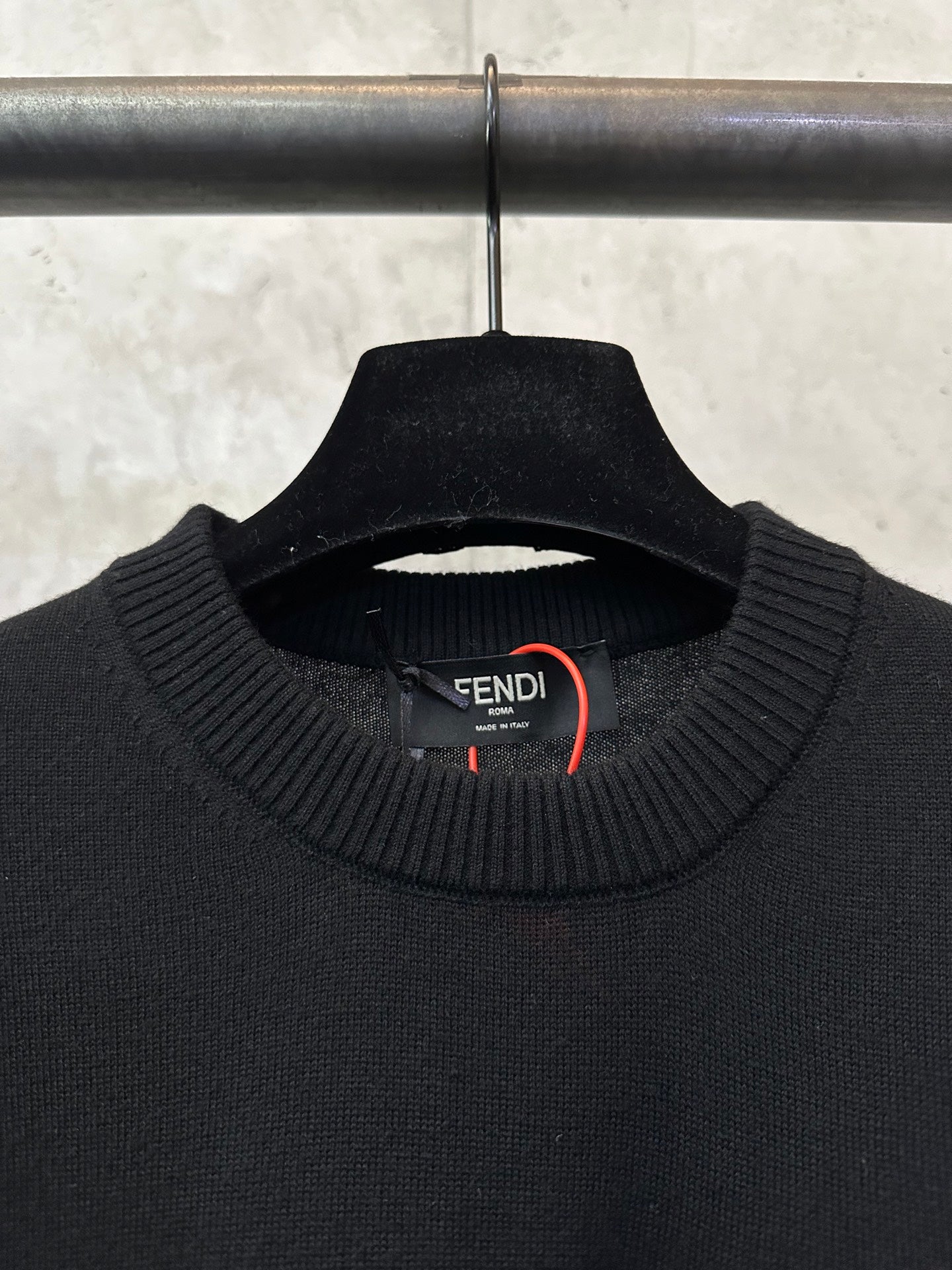 Black long-sleeve sweater neckline with Fendi inner tag