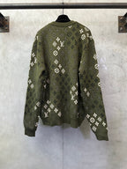 Long-sleeve knit sweater on hanger, olive green with allover white logo pattern