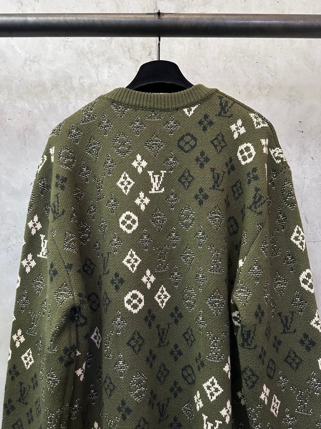 Long-sleeve sweater back view, olive green knit with white monogram pattern