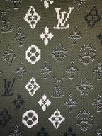 Long-sleeve sweater pattern close-up, olive knit with white diamond and monogram icons