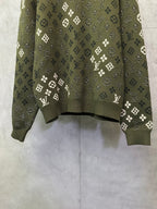 Long-sleeve sweater front, olive green knit with scattered white logo symbols
