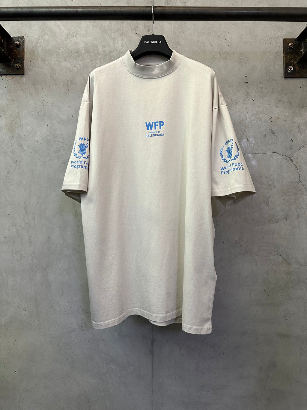 Off-white crewneck T-shirt with WFP World Food Programme logo print on chest and sleeves