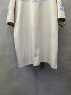 Off-white crewneck T-shirt back view with WFP blue sleeve logo and lower hem
