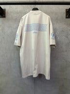 Off-white crewneck T-shirt, back view, WFP World Food Programme logo text and icons