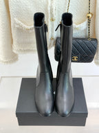 Chanel leather tall boots, back view with pull tabs and block heels