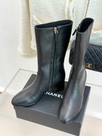 Chanel leather boots with side zipper and gold CC logo, on display box
