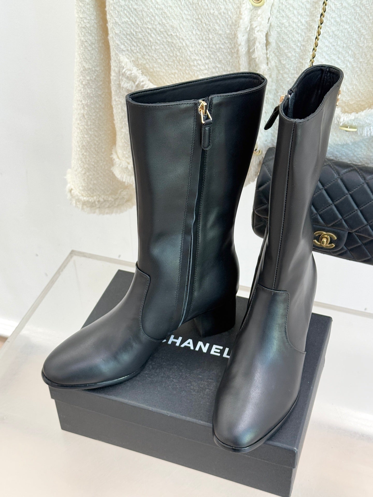 Chanel leather boots with side zipper and gold CC logo, on display box