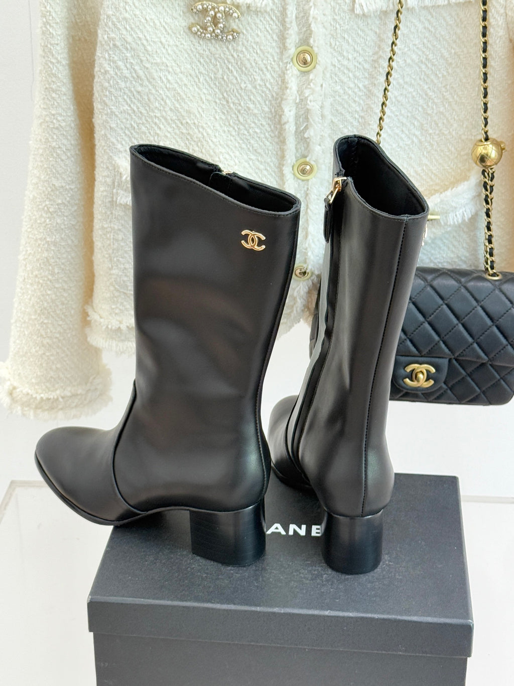 Chanel leather tall boots with gold CC logo on upper and side seam detail