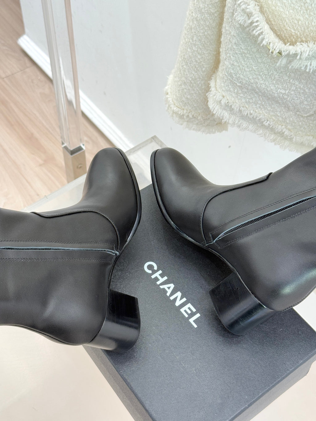 Chanel leather ankle boots with CHANEL logo on outsole and block heel