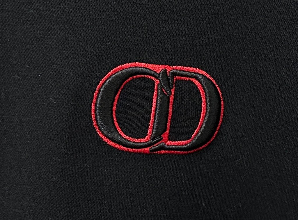 Red embroidered CD logo on black Dior crewneck sweatshirt