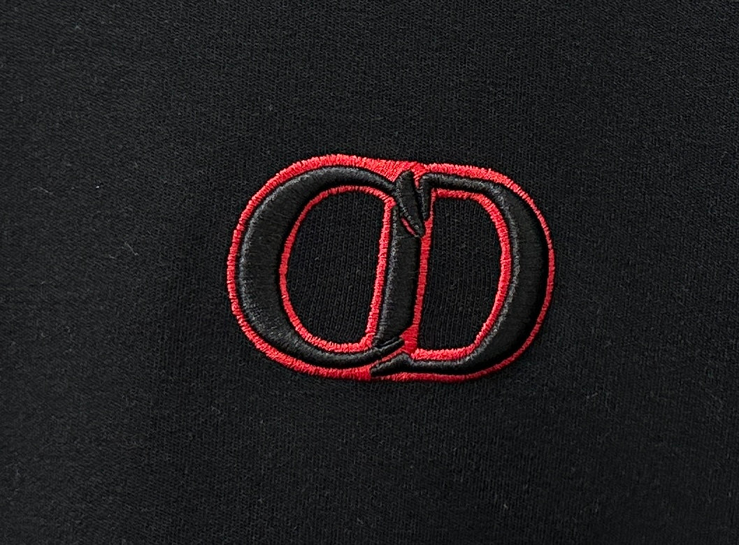 Red embroidered CD logo on black Dior crewneck sweatshirt