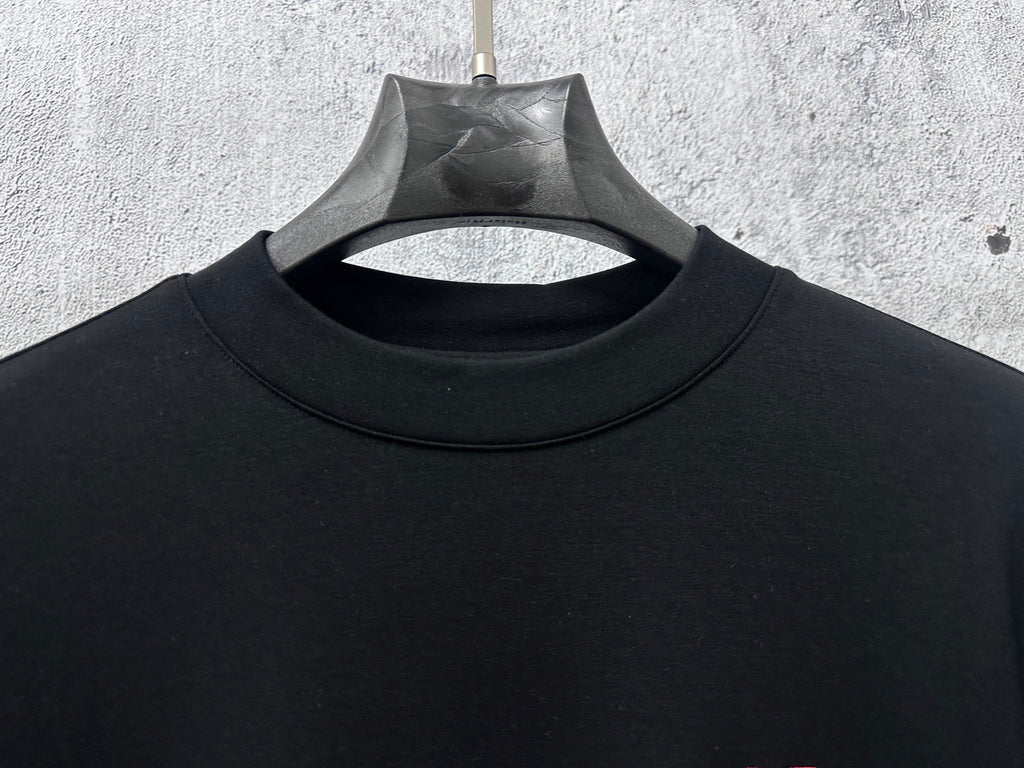 Black Dior crewneck sweatshirt neckline detail with hanging tag